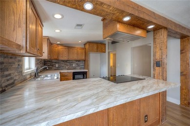 This home is the perfect blend of comfort, charm, function, and on Linn Valley Lakes - Deer Trace Golf Course in Kansas - for sale on GolfHomes.com, golf home, golf lot