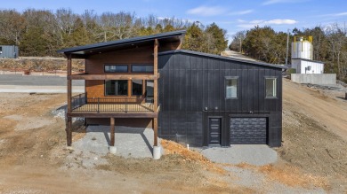 This brand new home is just a short easy walk to the community's on Kimberling City Golf Club in Missouri - for sale on GolfHomes.com, golf home, golf lot