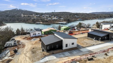 This brand new home is just a short easy walk to the community's on Kimberling City Golf Club in Missouri - for sale on GolfHomes.com, golf home, golf lot