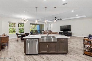 Experience luxury living in the gated Windchase section of on Halifax Plantation Golf Club in Florida - for sale on GolfHomes.com, golf home, golf lot