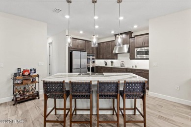 Experience luxury living in the gated Windchase section of on Halifax Plantation Golf Club in Florida - for sale on GolfHomes.com, golf home, golf lot