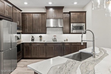 Experience luxury living in the gated Windchase section of on Halifax Plantation Golf Club in Florida - for sale on GolfHomes.com, golf home, golf lot