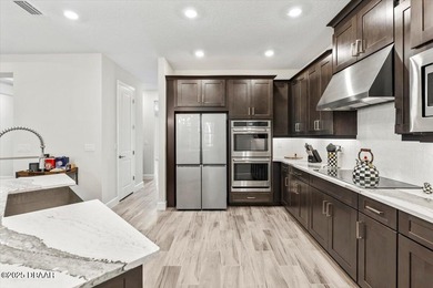 Experience luxury living in the gated Windchase section of on Halifax Plantation Golf Club in Florida - for sale on GolfHomes.com, golf home, golf lot