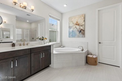 Experience luxury living in the gated Windchase section of on Halifax Plantation Golf Club in Florida - for sale on GolfHomes.com, golf home, golf lot