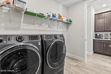 Experience luxury living in the gated Windchase section of on Halifax Plantation Golf Club in Florida - for sale on GolfHomes.com, golf home, golf lot