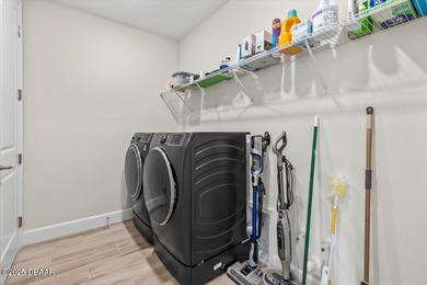 Experience luxury living in the gated Windchase section of on Halifax Plantation Golf Club in Florida - for sale on GolfHomes.com, golf home, golf lot