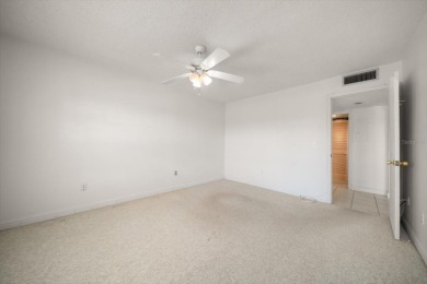 EASY FLORIDA LIVING AWAITS in this TOP FLOOR CONDO located in on Bayou Golf Club in Florida - for sale on GolfHomes.com, golf home, golf lot