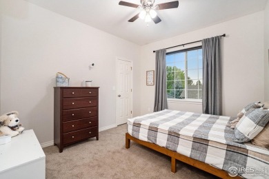 Enjoy the charm of shady, tree-lined streets as you arrive at on Pelican Lakes Golf and Country Club in Colorado - for sale on GolfHomes.com, golf home, golf lot