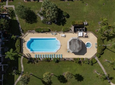 EASY FLORIDA LIVING AWAITS in this TOP FLOOR CONDO located in on Bayou Golf Club in Florida - for sale on GolfHomes.com, golf home, golf lot