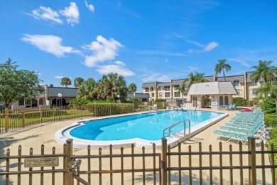 EASY FLORIDA LIVING AWAITS in this TOP FLOOR CONDO located in on Bayou Golf Club in Florida - for sale on GolfHomes.com, golf home, golf lot