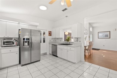 Discover the perfect blend of charm, comfort, and resort-style on Royal Oaks Golf Club in Florida - for sale on GolfHomes.com, golf home, golf lot