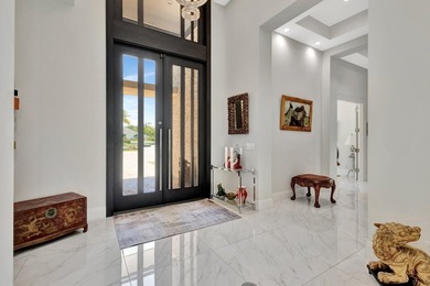 Welcome to waterfront living, in prestigious Frenchman's Creek on Frenchmans Creek Country Club in Florida - for sale on GolfHomes.com, golf home, golf lot