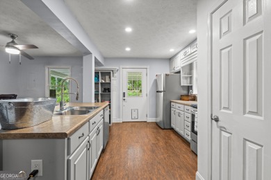 Nestled in the desirable Turtle Cove subdivision, this charming on Turtle Cove Golf Course in Georgia - for sale on GolfHomes.com, golf home, golf lot