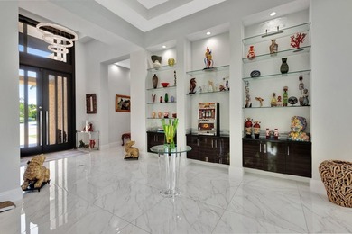 Welcome to waterfront living, in prestigious Frenchman's Creek on Frenchmans Creek Country Club in Florida - for sale on GolfHomes.com, golf home, golf lot