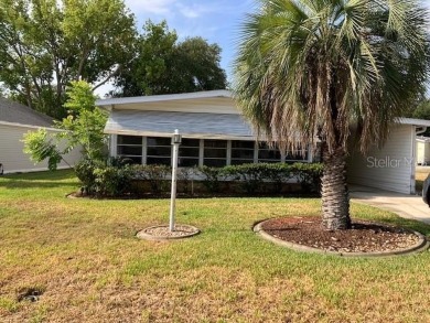 Welcome to this 2-bedroom, 2-bath manufactured home nestled in on Orange Blossom Hills Golf and Country Club in Florida - for sale on GolfHomes.com, golf home, golf lot