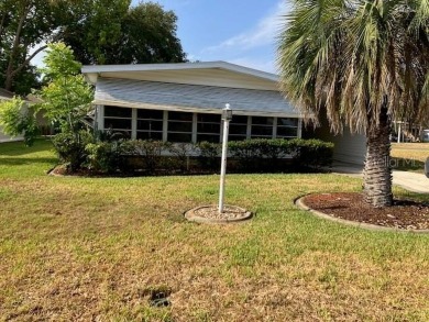 Welcome to this 2-bedroom, 2-bath manufactured home nestled in on Orange Blossom Hills Golf and Country Club in Florida - for sale on GolfHomes.com, golf home, golf lot
