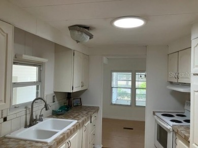 Welcome to this 2-bedroom, 2-bath manufactured home nestled in on Orange Blossom Hills Golf and Country Club in Florida - for sale on GolfHomes.com, golf home, golf lot