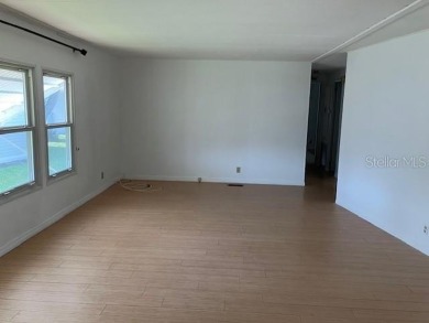 Welcome to this 2-bedroom, 2-bath manufactured home nestled in on Orange Blossom Hills Golf and Country Club in Florida - for sale on GolfHomes.com, golf home, golf lot