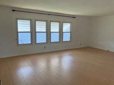 Welcome to this 2-bedroom, 2-bath manufactured home nestled in on Orange Blossom Hills Golf and Country Club in Florida - for sale on GolfHomes.com, golf home, golf lot