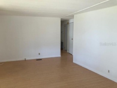 Welcome to this 2-bedroom, 2-bath manufactured home nestled in on Orange Blossom Hills Golf and Country Club in Florida - for sale on GolfHomes.com, golf home, golf lot