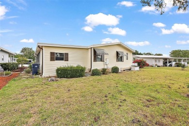 This 2 bedroom 2 bath home is situated on an oversized lot just on Bay Tree Golf Course in Florida - for sale on GolfHomes.com, golf home, golf lot