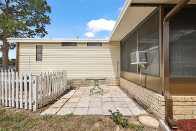 This 2 bedroom 2 bath home is situated on an oversized lot just on Bay Tree Golf Course in Florida - for sale on GolfHomes.com, golf home, golf lot