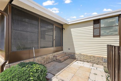 This 2 bedroom 2 bath home is situated on an oversized lot just on Bay Tree Golf Course in Florida - for sale on GolfHomes.com, golf home, golf lot