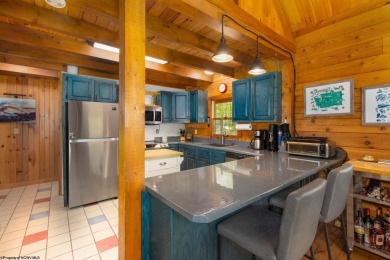 Escape to 'Rustic Refuge', a charming LOG CHALET nestled within on Alpine Lake Resort in West Virginia - for sale on GolfHomes.com, golf home, golf lot