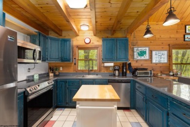 Escape to 'Rustic Refuge', a charming LOG CHALET nestled within on Alpine Lake Resort in West Virginia - for sale on GolfHomes.com, golf home, golf lot