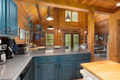 Escape to 'Rustic Refuge', a charming LOG CHALET nestled within on Alpine Lake Resort in West Virginia - for sale on GolfHomes.com, golf home, golf lot