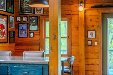 Escape to 'Rustic Refuge', a charming LOG CHALET nestled within on Alpine Lake Resort in West Virginia - for sale on GolfHomes.com, golf home, golf lot