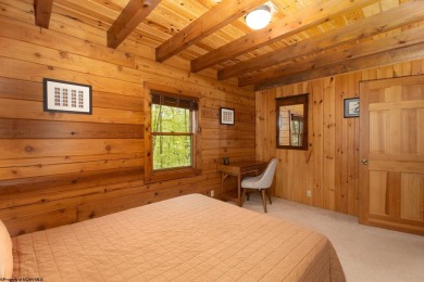 Escape to 'Rustic Refuge', a charming LOG CHALET nestled within on Alpine Lake Resort in West Virginia - for sale on GolfHomes.com, golf home, golf lot