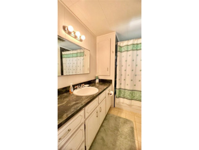 This beautifully maintained 2-bedroom, 2-bath home is truly on Fairway Village Golf Course in Florida - for sale on GolfHomes.com, golf home, golf lot
