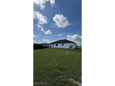 This stunning new construction features impact windows and doors on Burnt Store Golf Club in Florida - for sale on GolfHomes.com, golf home, golf lot