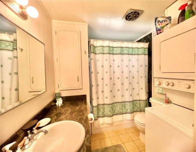 This beautifully maintained 2-bedroom, 2-bath home is truly on Fairway Village Golf Course in Florida - for sale on GolfHomes.com, golf home, golf lot