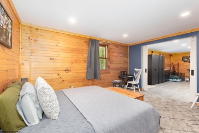 Escape to 'Rustic Refuge', a charming LOG CHALET nestled within on Alpine Lake Resort in West Virginia - for sale on GolfHomes.com, golf home, golf lot