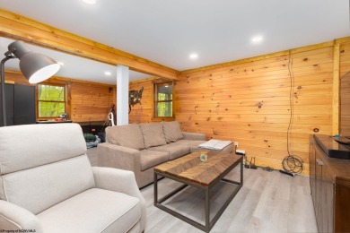 Escape to 'Rustic Refuge', a charming LOG CHALET nestled within on Alpine Lake Resort in West Virginia - for sale on GolfHomes.com, golf home, golf lot