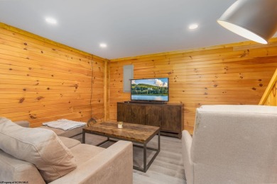 Escape to 'Rustic Refuge', a charming LOG CHALET nestled within on Alpine Lake Resort in West Virginia - for sale on GolfHomes.com, golf home, golf lot
