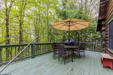 Escape to 'Rustic Refuge', a charming LOG CHALET nestled within on Alpine Lake Resort in West Virginia - for sale on GolfHomes.com, golf home, golf lot