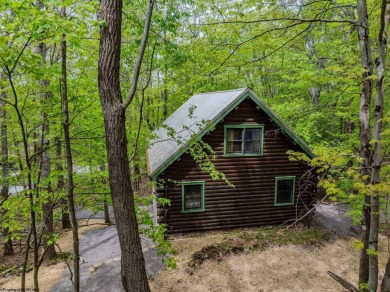 Escape to 'Rustic Refuge', a charming LOG CHALET nestled within on Alpine Lake Resort in West Virginia - for sale on GolfHomes.com, golf home, golf lot