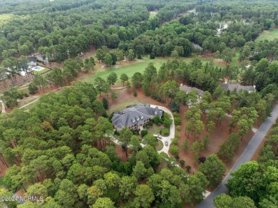 Nestled among almost 3 acres of longleaf pines, this exquisite on Pinewild Country Club of Pinehurst in North Carolina - for sale on GolfHomes.com, golf home, golf lot