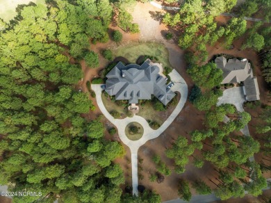 Nestled among almost 3 acres of longleaf pines, this exquisite on Pinewild Country Club of Pinehurst in North Carolina - for sale on GolfHomes.com, golf home, golf lot