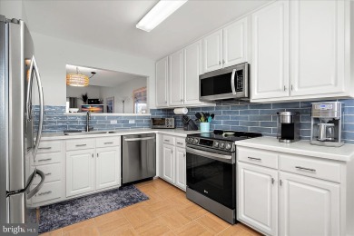 Direct bay views abound from this beautiful 2-story condo in on Bethany Bay Golf Club in Delaware - for sale on GolfHomes.com, golf home, golf lot