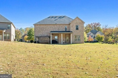 Experience unparalleled luxury in this stunning all-brick estate on Canongate At Heron Bay in Georgia - for sale on GolfHomes.com, golf home, golf lot