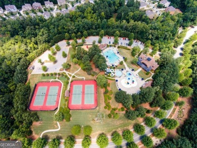 Experience unparalleled luxury in this stunning all-brick estate on Canongate At Heron Bay in Georgia - for sale on GolfHomes.com, golf home, golf lot