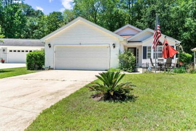 Nestled on a quiet a cul-de-sac surrounded by lush, mature trees on Island Green Golf Club in South Carolina - for sale on GolfHomes.com, golf home, golf lot