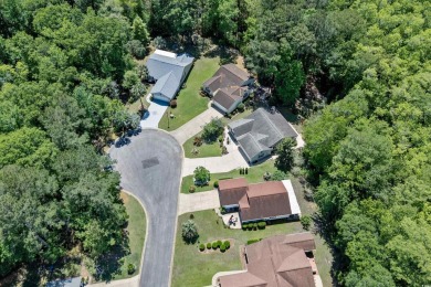 Nestled on a quiet a cul-de-sac surrounded by lush, mature trees on Island Green Golf Club in South Carolina - for sale on GolfHomes.com, golf home, golf lot