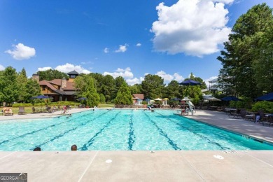 Experience unparalleled luxury in this stunning all-brick estate on Canongate At Heron Bay in Georgia - for sale on GolfHomes.com, golf home, golf lot