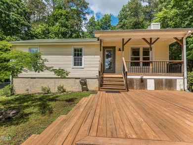 Welcome to Lake Royale! This adorable 3-bedroom home is situated on River Golf and County Club at Lake Royale in North Carolina - for sale on GolfHomes.com, golf home, golf lot
