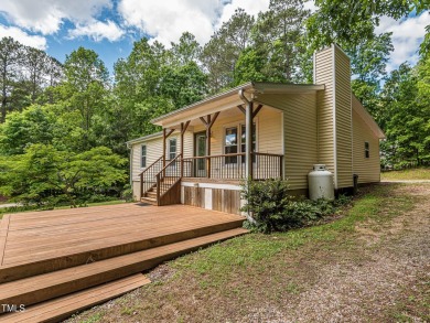 Welcome to Lake Royale! This adorable 3-bedroom home is situated on River Golf and County Club at Lake Royale in North Carolina - for sale on GolfHomes.com, golf home, golf lot